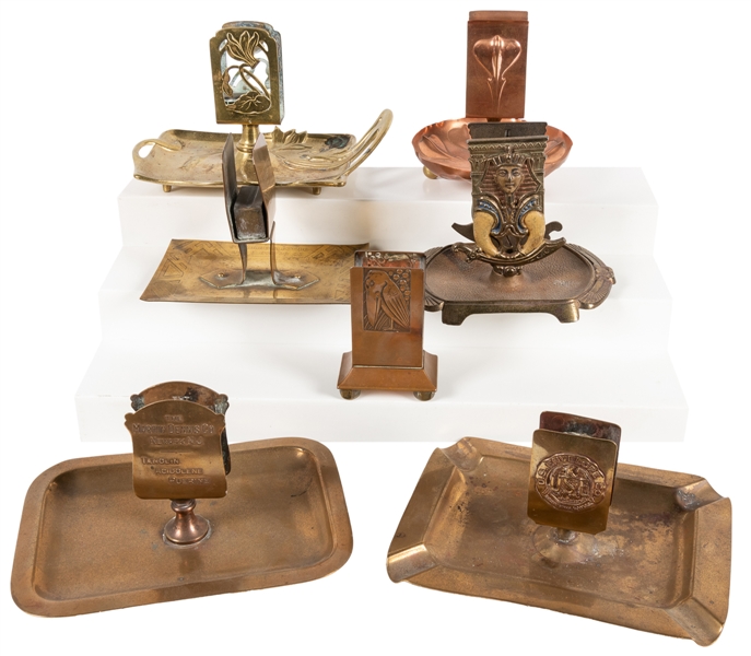  Group of 7 Metal Matchbox Holders and Ashtrays. Circa early...