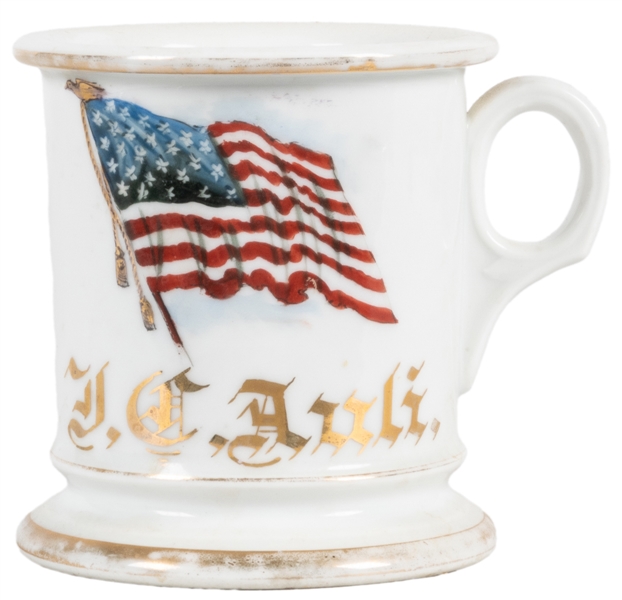  American Flag Shaving Mug. Gilt painted porcelain, lettered...