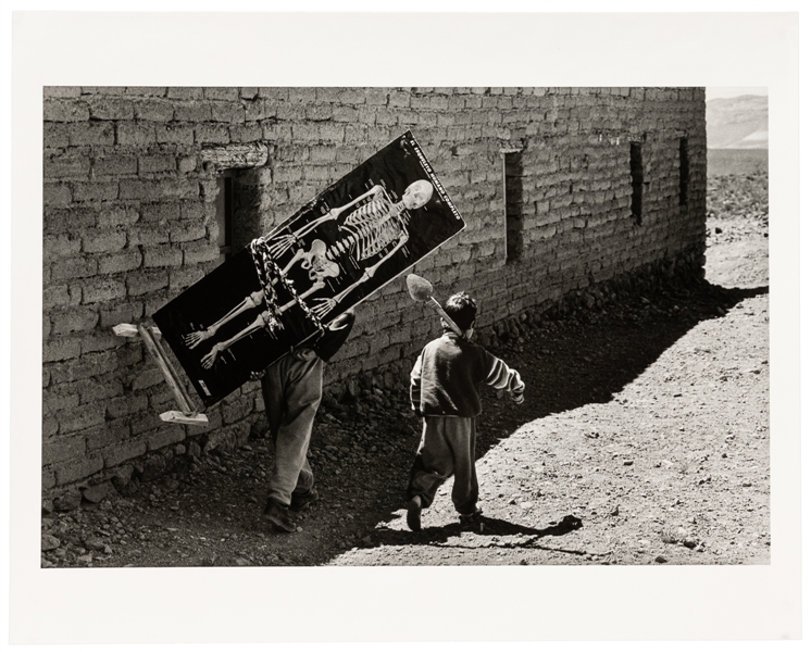 BOSCHI, Lucio (b. 1966). Photo of Boys with Skeleton. Bolivia, 1999.