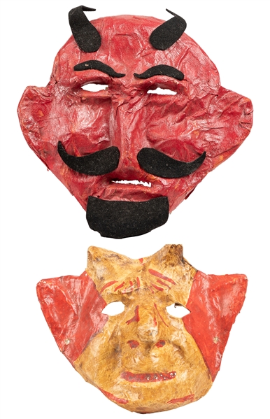 [HALLOWEEN]. Pair of Devil Masks. 1950s. Paper mâché, paint...