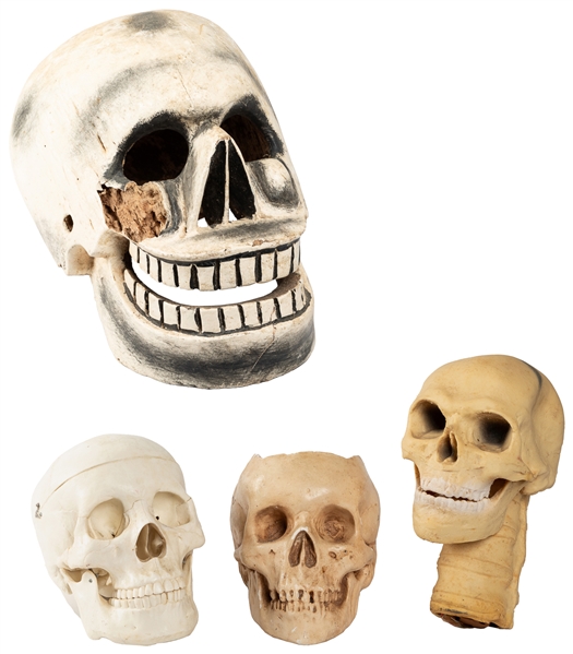 Group of 4 Decorative and Novelty Skulls. Includes: One car...