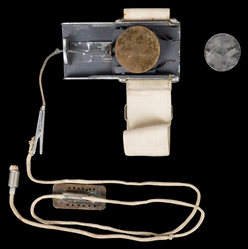 Coin Shooting Gimmick. Circa 1950. Holdout-like aluminum an...
