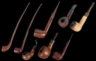  Collection of 80 Pipes and Three Pipe Racks. Large collecti...