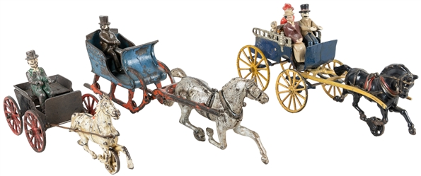 Two Cast Iron Horse Drawn Carriages and One Sleigh. One car...