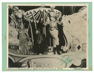  KELLY, Emmett. Eight photographs, three signed by Kelly. Ci...