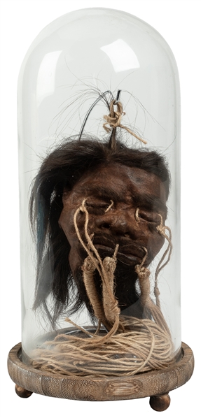  Shrunken Head Gaff Display. Circa 20th century. Gaff shrunk...