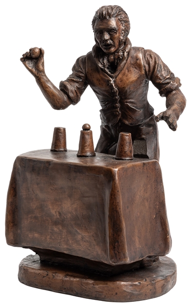  Cups and Balls Magician Sculpture. 1983. Bronze statue show...