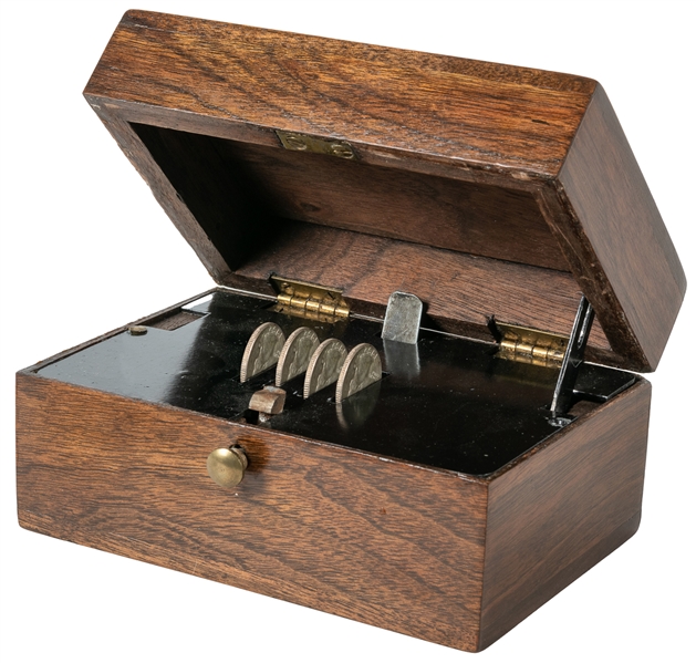  Coin Casket. Circa 1920. Four silver quarters, placed in sl...