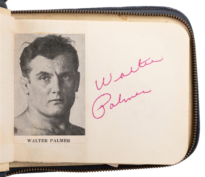  A Mid-Century Wrestling Autograph Album. Zippered navy leat...