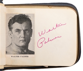  A Mid-Century Wrestling Autograph Album. Zippered navy leat...