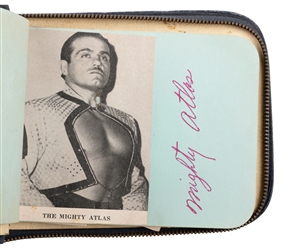  A Mid-Century Wrestling Autograph Album. Zippered navy leat...