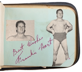  A Mid-Century Wrestling Autograph Album. Zippered navy leat...